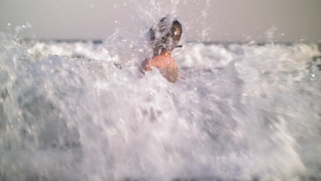 Child-bathing-in-the-sea-and-waves-hit-him