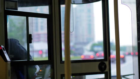 Woman-driving-bus-in-the-city