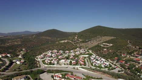Town-at-the-bottom-of-green-hills-aerial
