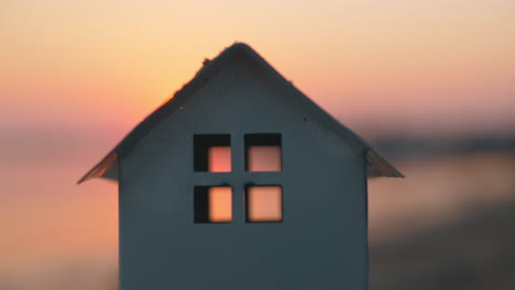 House-model-on-the-beach-at-sunset