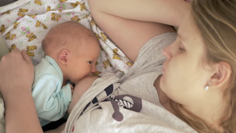 Mum-sleeping-when-nursing-newborn-baby