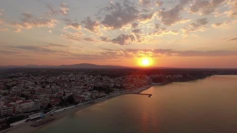 Aerial-scene-of-coastal-town-at-sunrise-Nea-Kallikratia-Greece