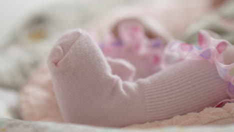 Baby-girl-feet-in-pink-socks