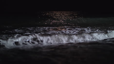 Dark-foamy-waves-washing-the-seashore-at-night