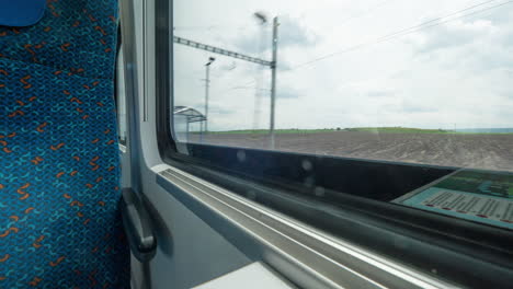 Time-lapse-shot-inside-of-modern-empty-train-wagon-with-table-seat-places-and-windows-Vienna-Austria