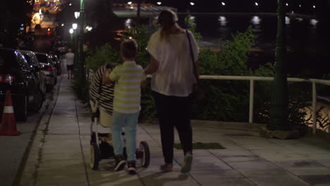 Mother-having-evening-walk-with-elder-son-and-baby