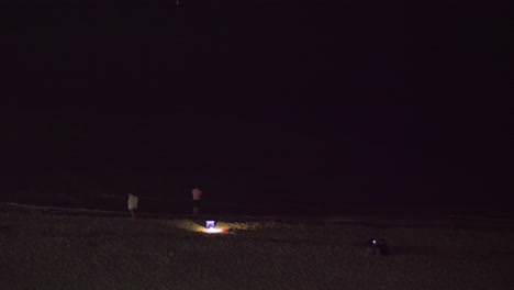 People-on-the-beach-at-night