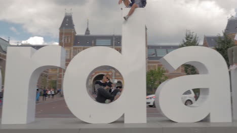 View-of-I-Amsterdam-sign-and-people-on-Amsterdam-Museumplein-Netherlands