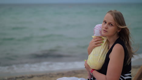 Sad-mum-with-baby-near-the-sea