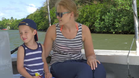 Mother-and-son-having-nature-boat-travel