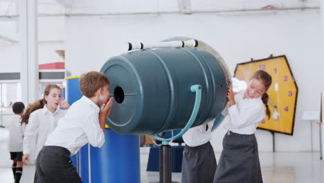 Kids-playing-with-an-air-cannon-at-a-science-activity-centre