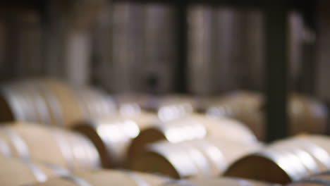 Rows-of-barrels-in-a-modern-wine-factory-warehouse