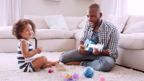 Young-black-dad-and-his-young-daughter-playing-instruments