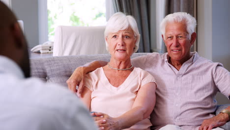 Happy-senior-couple-in-a-meeting-with-a-financial-advisor