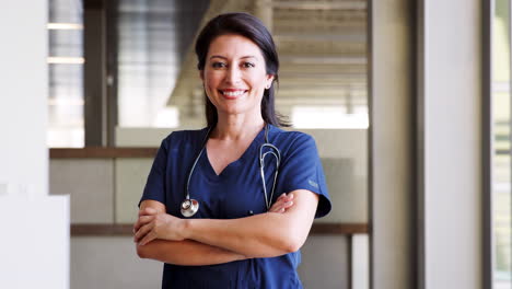 Hispanic-female-doctor-wearing-scrubs