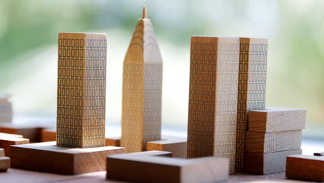 Set-of-model-wooden-tower-blocks-arranged-on-a-table
