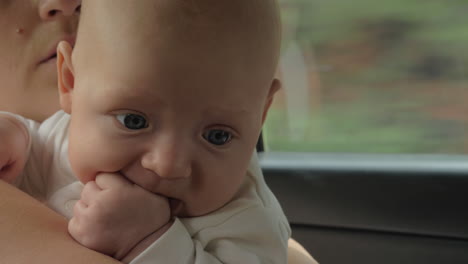 Quiet-baby-traveling-by-car-with-mum