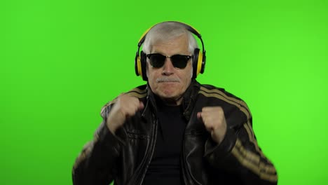 Elderly-senior-caucasian-grandfather-rocker-man-dance,-listen-music.-Chroma-key