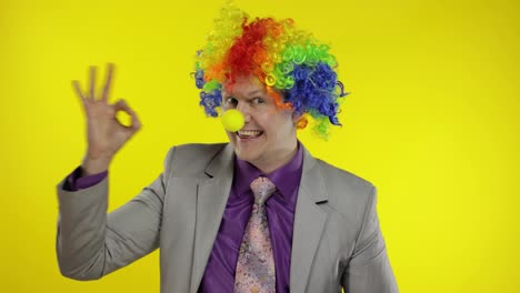 Clown-businessman-manager-entrepreneur-boss-in-wig-show-ok-sign.-Halloween