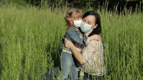 Family-in-park-takes-off-medical-masks-after-coronavirus-pandemic-quarantine-end