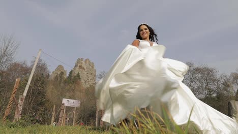 Beautiful-and-lovely-bride-in-wedding-dress-and-veil.-Slow-motion
