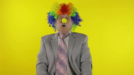 Senior-clown-businessman-entrepreneur-show-light-bulb.-Came-up-with-great-idea