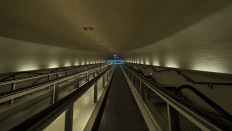 Timelapse-of-passing-through-the-tunnel-by-travelator-at-the-airport