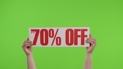 70-Percent-Off-advertisement-inscription-on-paper-sheet-in-womans-hands-on-chroma-key.-Slow-motion