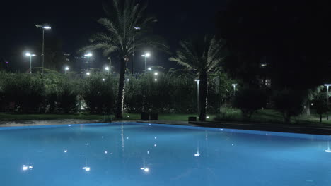 Night-view-of-swimming-pool-on-resort