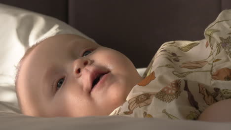 Indoor-portrait-of-happy-six-months-old-baby-girl