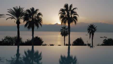 Outdoor-pool-on-resort-and-nature-landscape-at-sunset-Turkey