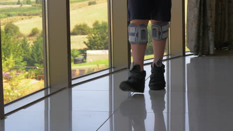 FES-treatment-Boy-with-foot-drop-system-walking-indoor
