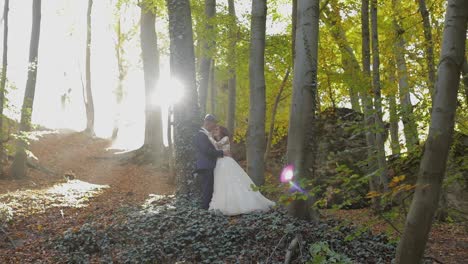 Groom-with-bride-in-the-forest-park.-Wedding-couple.-Happy-family