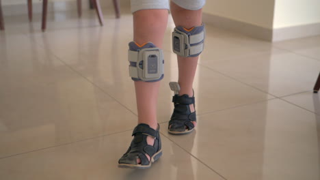 Therapy-with-functional-electrical-stimulation-Kid-wearing-foot-drop-system