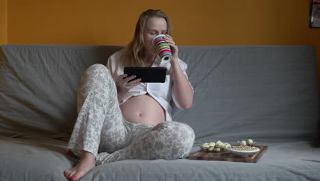 Pregnant-woman-chilling-on-a-sofa