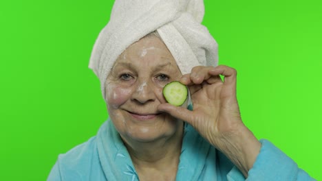 Elderly-grandmother-in-bathrobe.-Old-woman-with-slice-of-cucumber