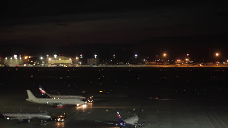 Timelapse-of-airplane-and-truck-traffic-in-Sheremetyevo-Airport-at-night-Moscow