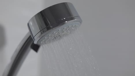 Shower-head-in-bathroom-with-water-drops-flowing.-Water-drops-in-the-shower-head