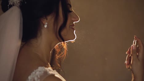 Beautiful-bride-splits-the-perfume-on-herself.-Wedding-day.-Slow-motion