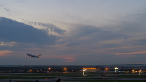 Passenger-airplane-taking-off-in-the-dusk