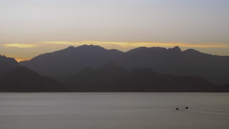 Dark-mountains-by-the-sea-in-the-evening
