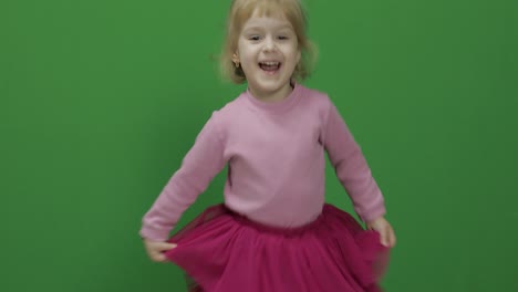 Happy-three-years-old-girl.-Cute-blonde-child.-Dancing-and-make-faces