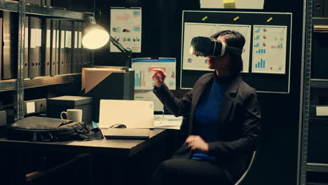 Law-enforcement-agent-works-with-virtual-reality-glasses-in-incident-room