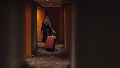Woman-settling-in-hotel-room