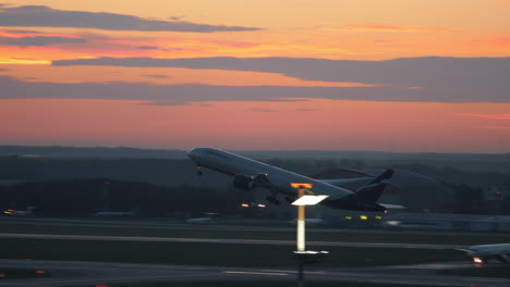 Airplane-taking-off-from-runway-and-flying-in-the-evening-sky-Russia