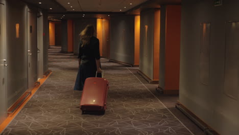 Hotel-guest-with-trolley-case-walking-to-the-room