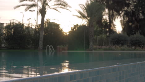 Outdoor-swimming-pool-at-sunset