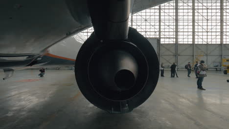 Back-view-on-jet-turbine-in-repair-hangar
