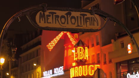 Street-with-subway-entrance-and-Moulin-Rouge-in-Paris-France