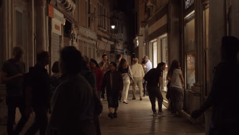 Lively-street-in-night-Venice-Italy